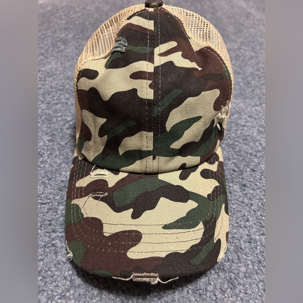 Women’s distressed Camouflage Hat with Velcro adjustable strap on back.